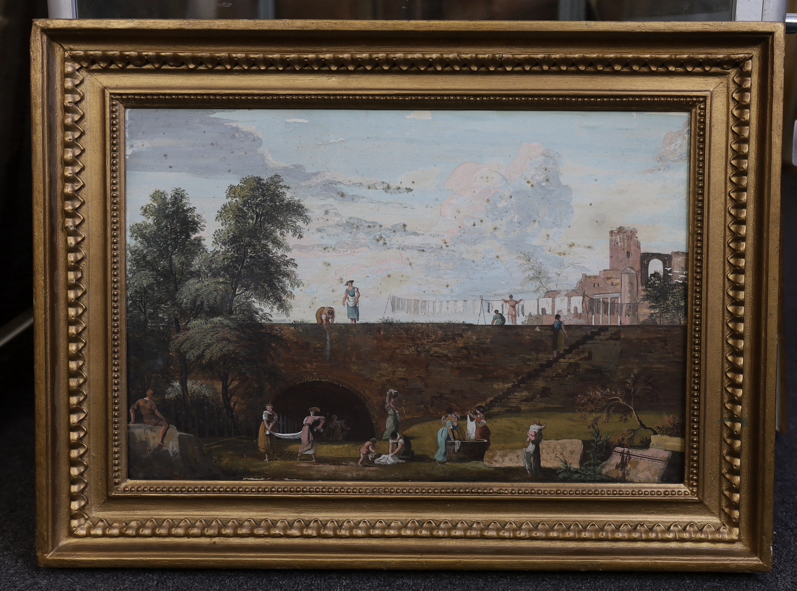 Attributed to Marco Ricci (Italian, 1676-1729), Outskirts of a town with women washing linen, tempera on panel, 30 x 45cm